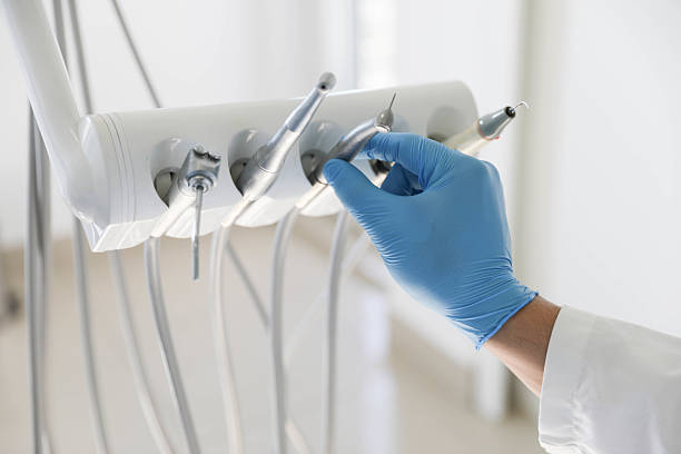 Professional Tooth Extraction technician working in Rochester, IL